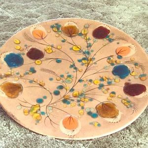 Hand painted on large round copper plate.